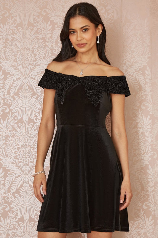 Mela Black Velvet Skater Dress With Sparkle Bow Neckline Mela