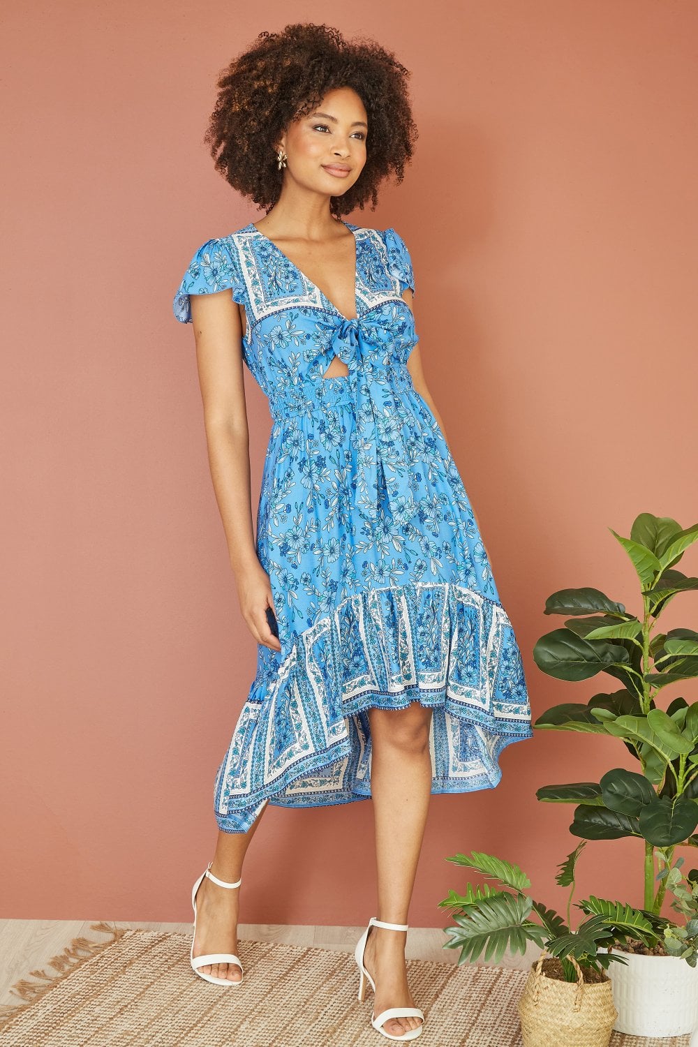 Mela Blue Ditsy Print Sun Dress With Cross Over Back Tie Front And Dip Hem Mela