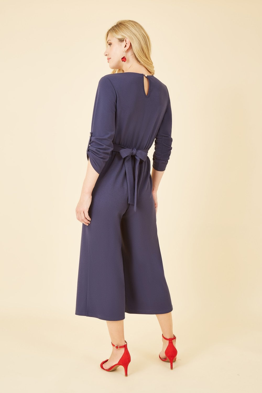 Mela Navy Wrap Over Stretch Jumpsuit With Gold Belt Mela